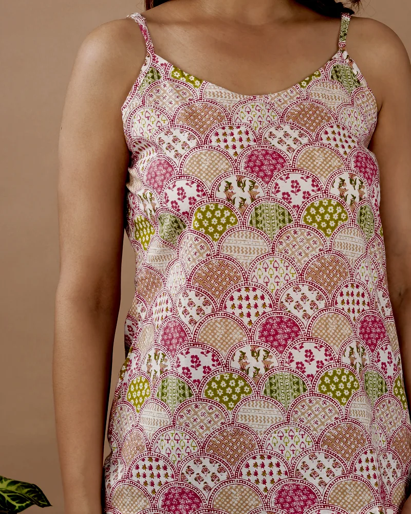 A Bagru-print cotton camisole in rose and olive scallops.