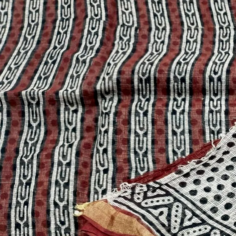 Kota doria showing its open khat square-check weave under a black and madder block print.