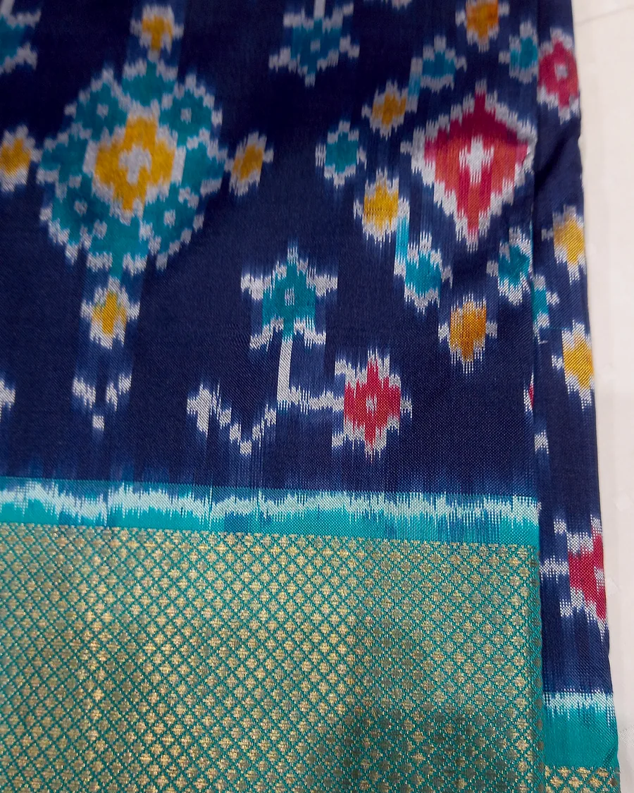 Indigo Pochampally double-ikat, close enough to see the resist-dyed threads feather.